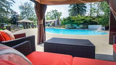 A view of the pool as seen from the patio furniture